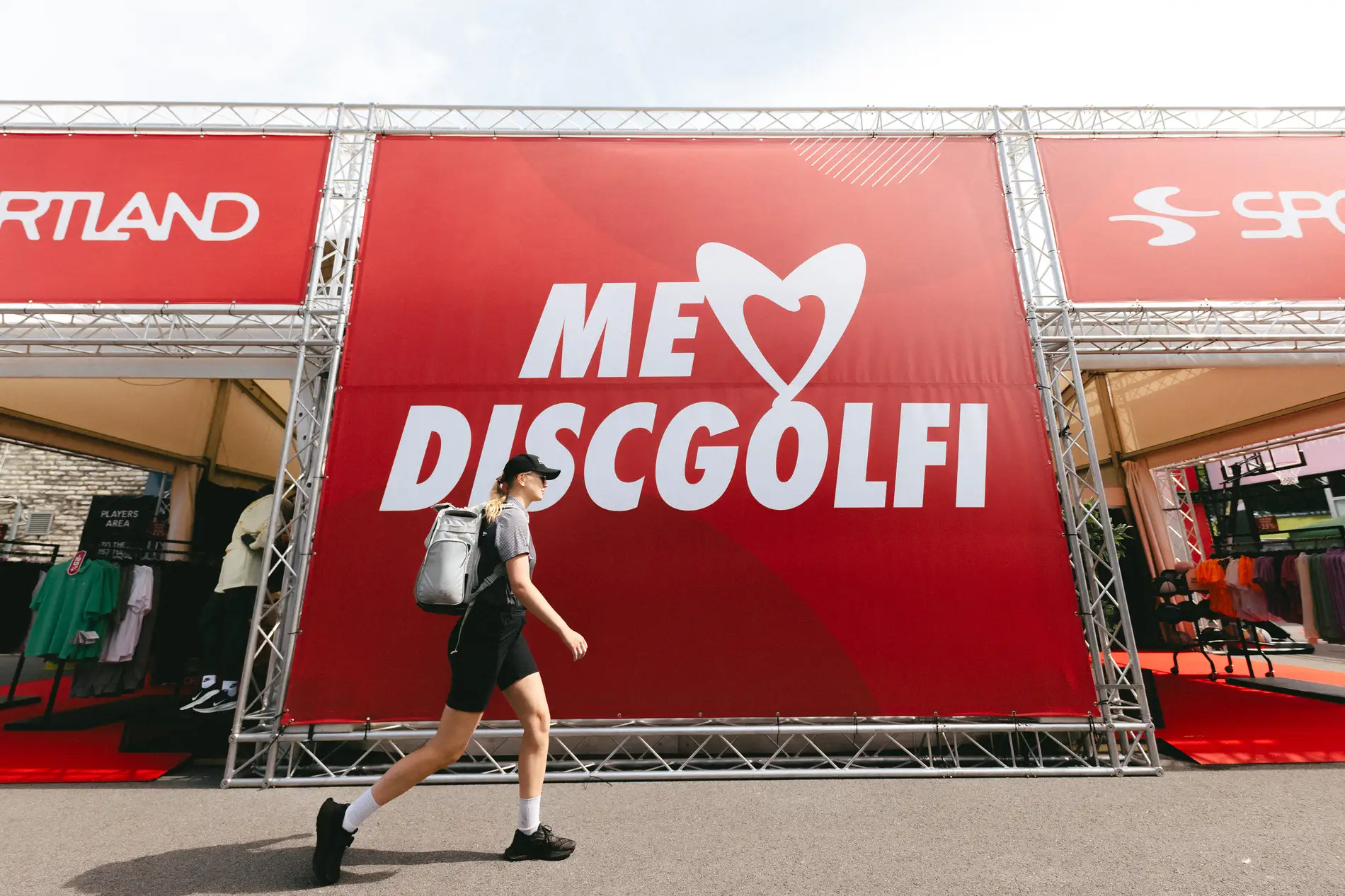 Festival visitors at a partner activation wall