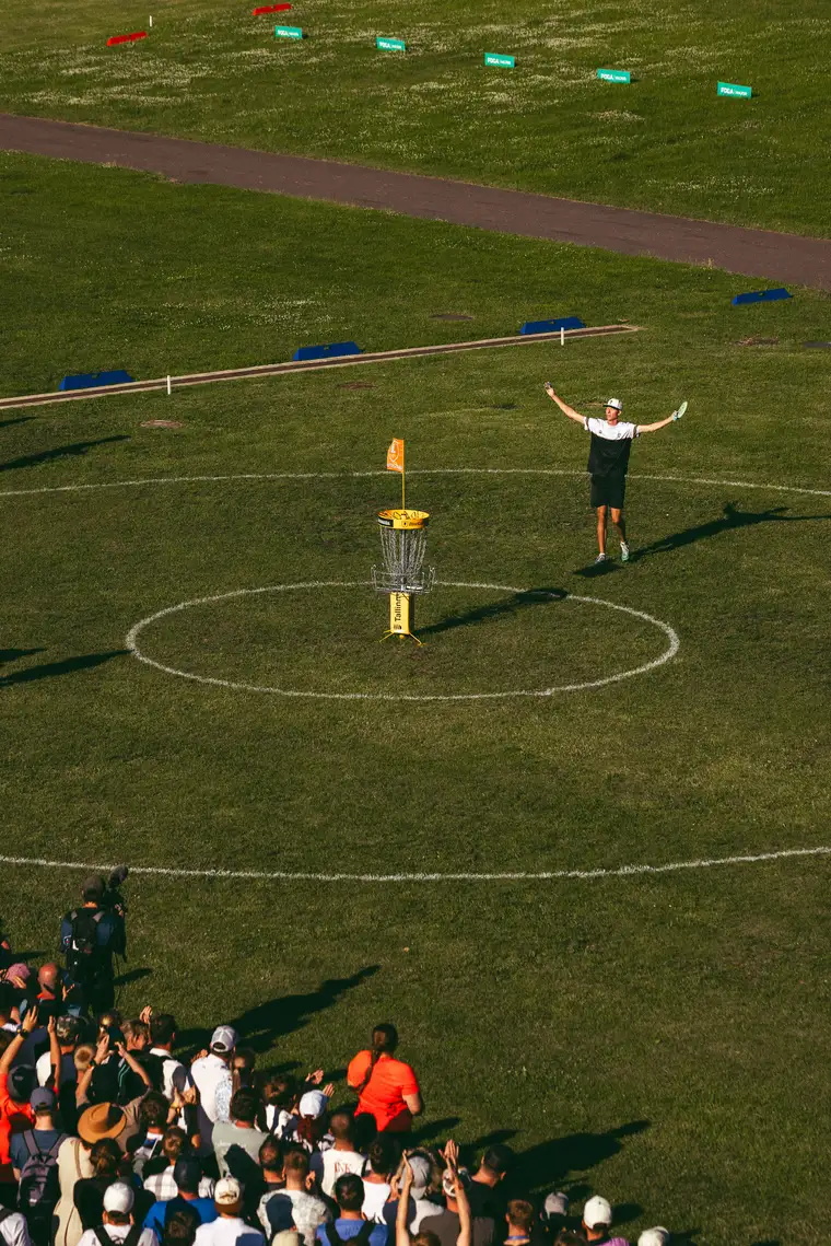 A player celebrating in the putting circle