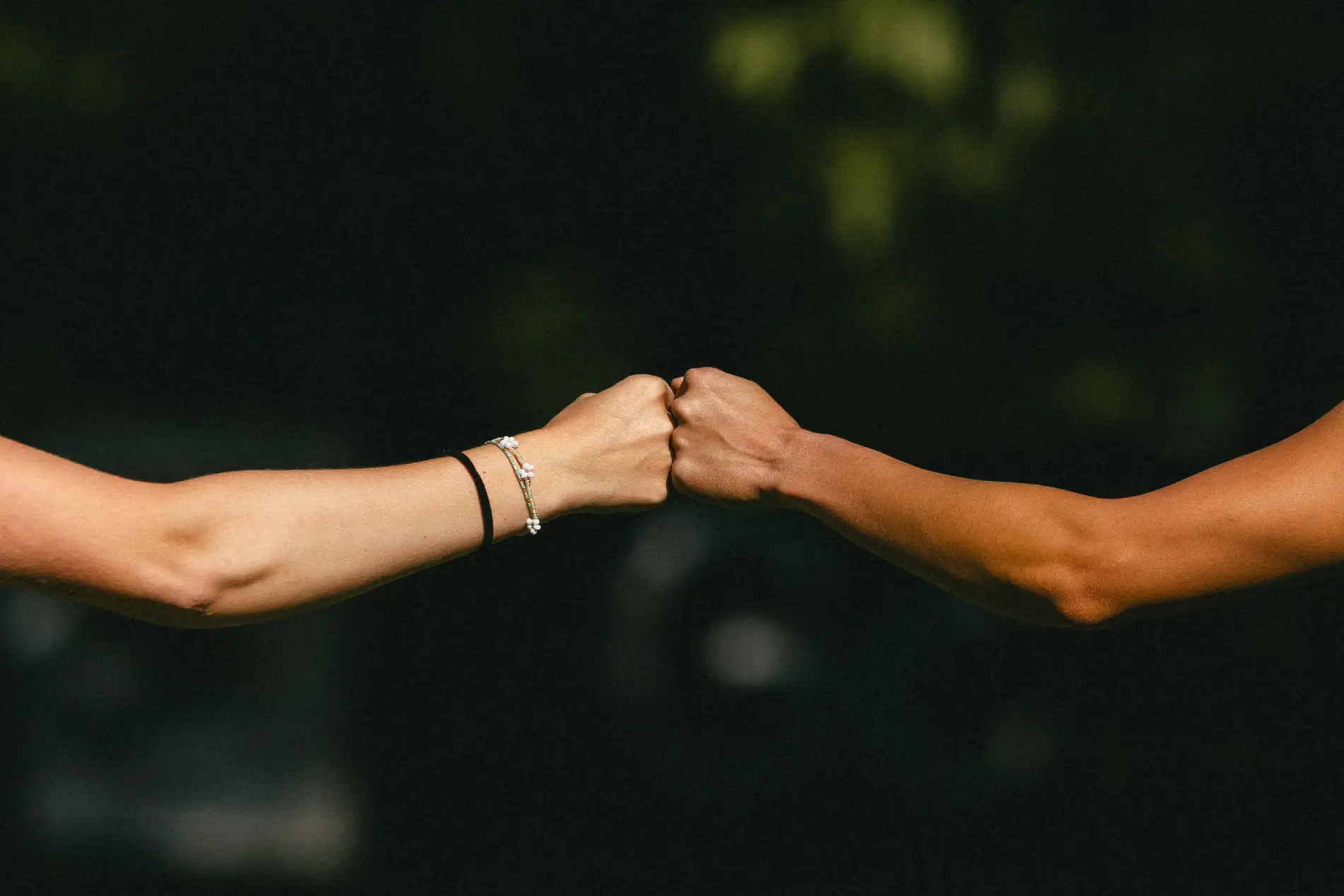 Two players bumping fists after a round