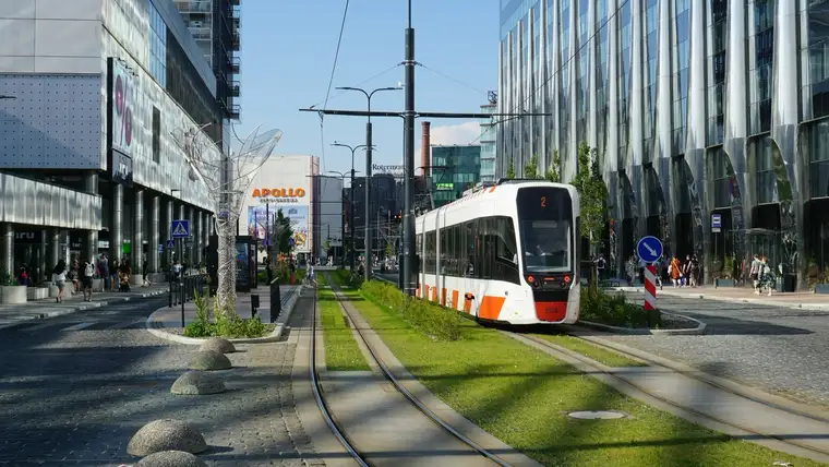 A modern tram on a grass track in Tallinn