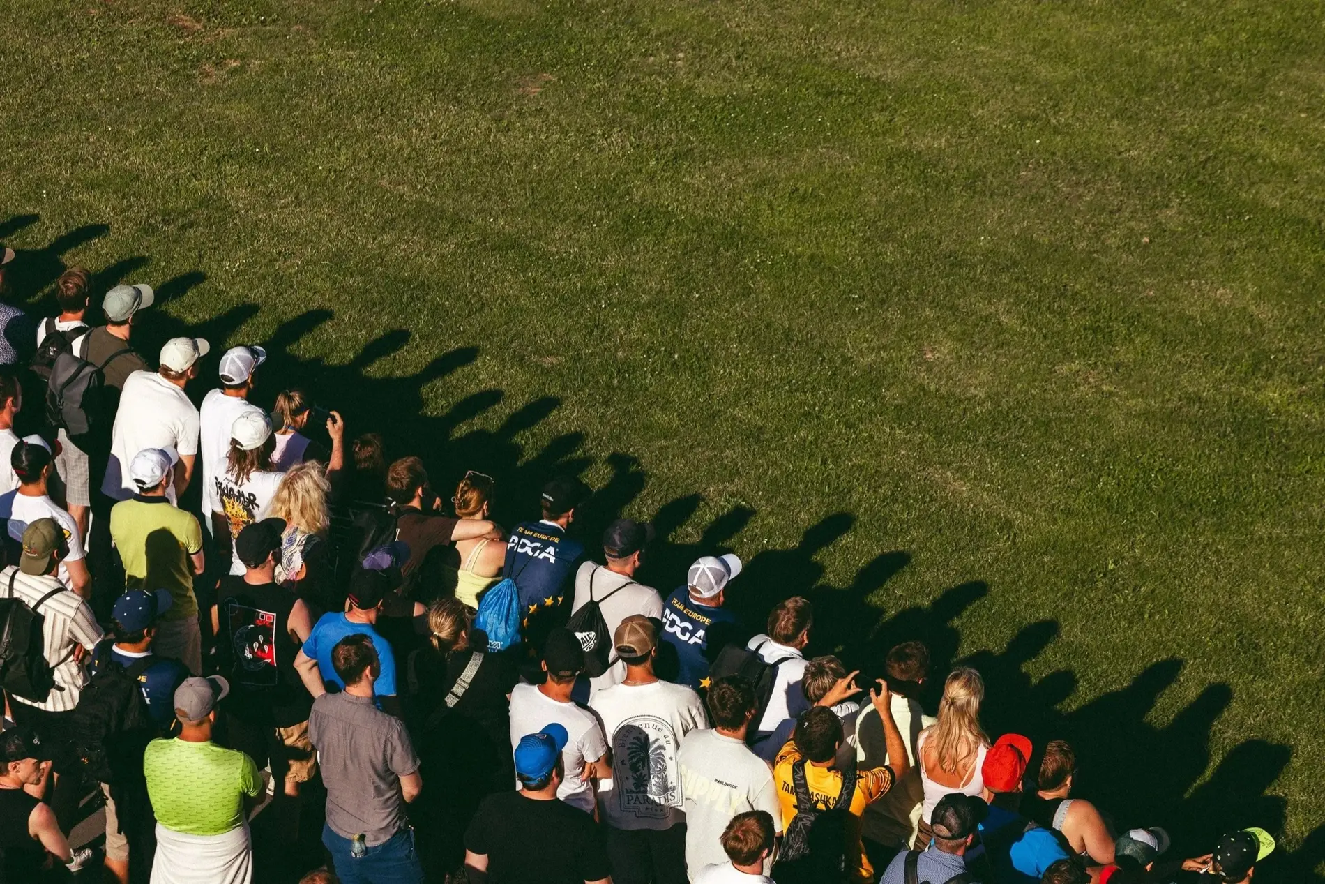 Spectators lining a fairway at the Song Festival Grounds, seen from above