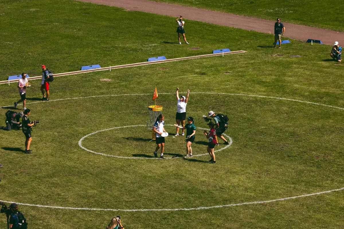Players and the gallery around a basket at the Song Festival Grounds, seen from above